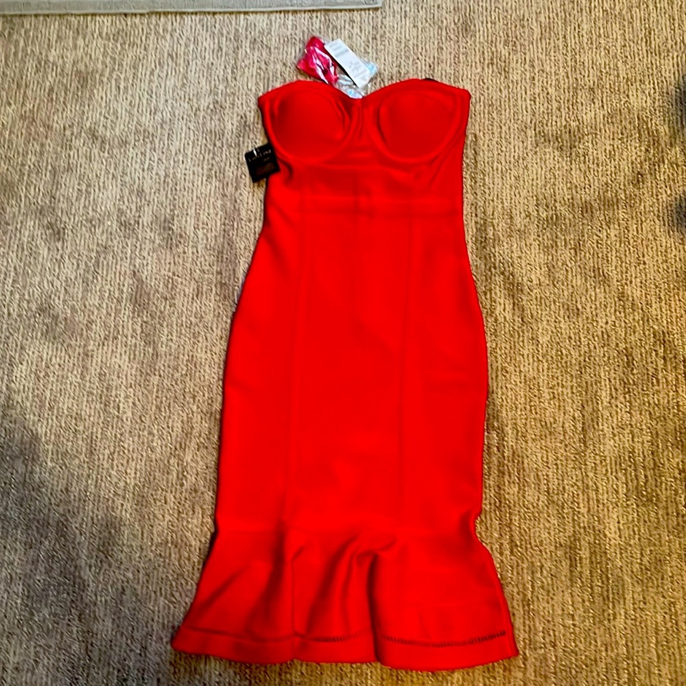 Beautiful red dress by Bebe never been worn and with tag